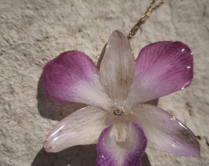Singapore orchid necklace embedded in resin and gold-plated silver chain.