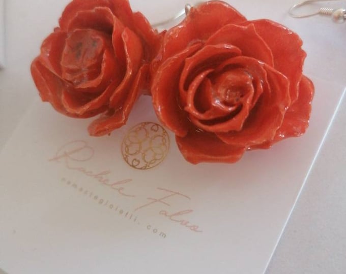 Pair of earrings with natural rose buds embedded in resin, silver hook