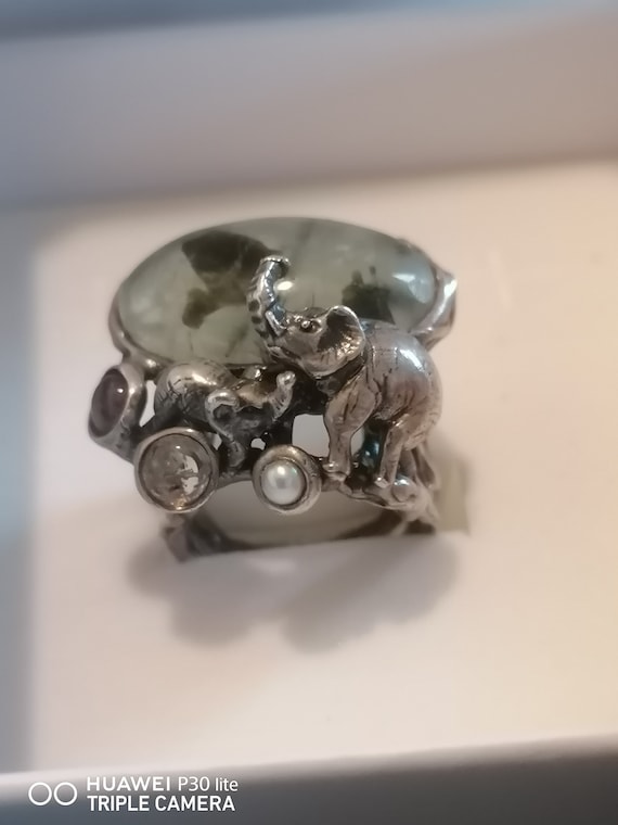Solid silver ring with lucky elephants set with central green corundum, pearl and labradorite