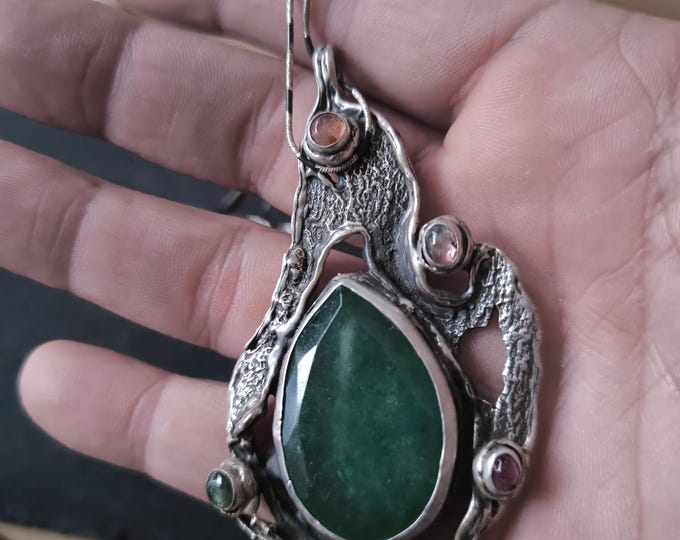 Organically crafted silver pendant complete with chain featuring a central drop of green Imperial Jade and mixed-color tourmalines.