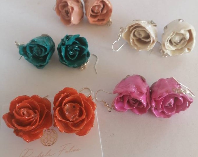 Pair of earrings with natural rose buds embedded in resin, silver hook