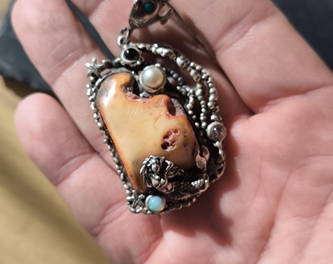 Solid silver mermaid and starfish pendant finished with a central amber, opal, tourmaline and pearl.
