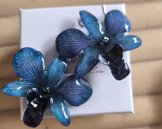 Rare pair of natural black purple orchids embedded in resin