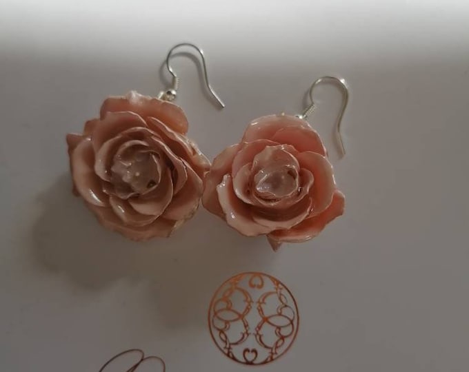 Earrings with natural roses embedded in resin