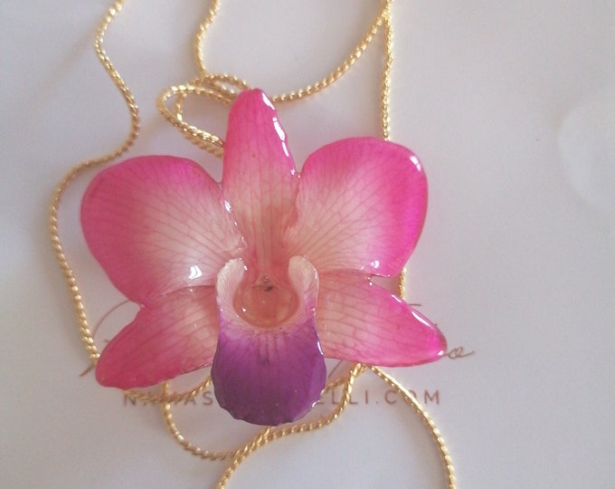 Saliscendi galvanizzato in oro con orchidea naturale rosa inglobata in resina