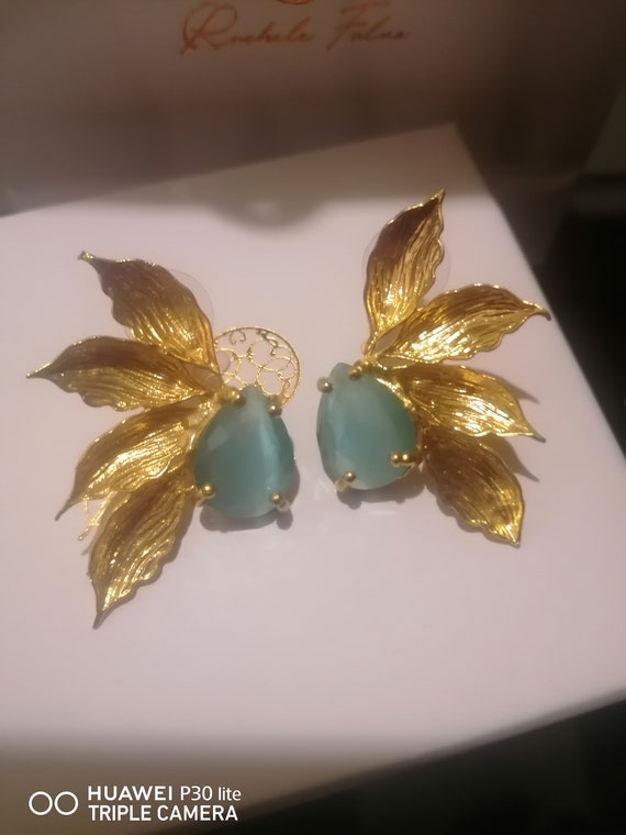 Etruscan leaf earrings in matt gold on bronze and finished with natural faceted blue quartz