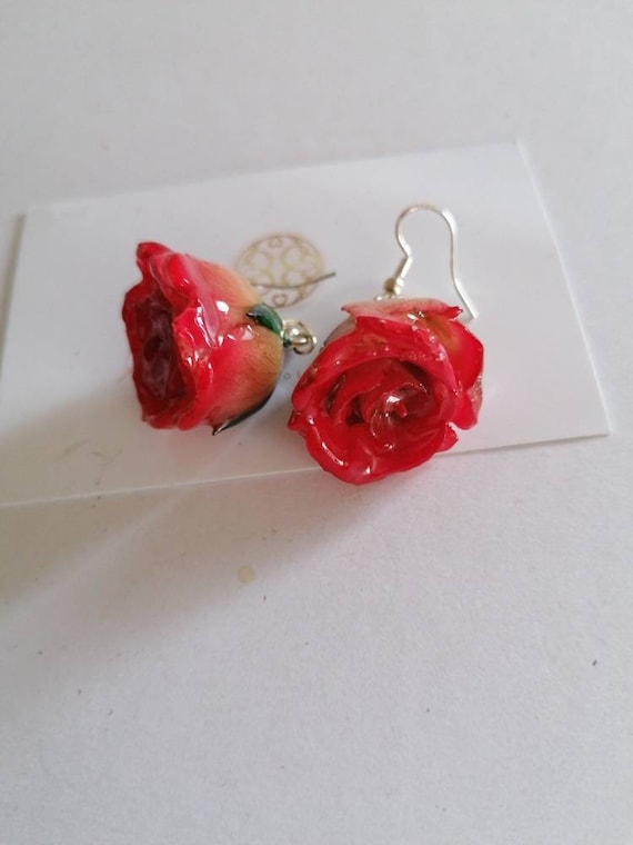 Pair of natural roses embedded in resin with silver hook