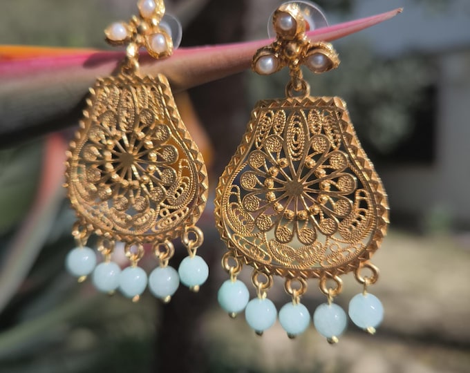 gold filigree earrings with natural faceted blue topazes