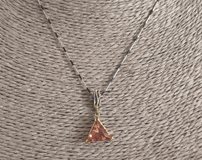 Spectacular pendant complete with burnished silver chain, gold-plated embroidery and central triangle-cut charite