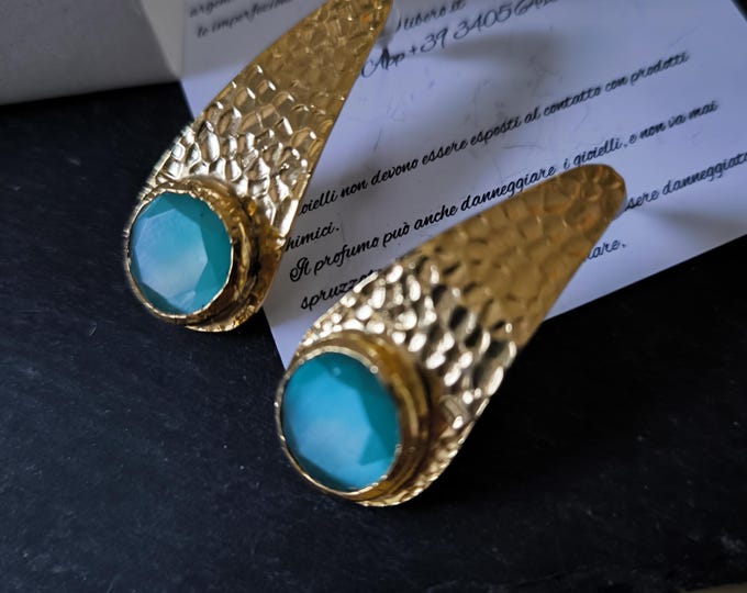 Gold earrings with natural blue or aquamarine cat's eye stones