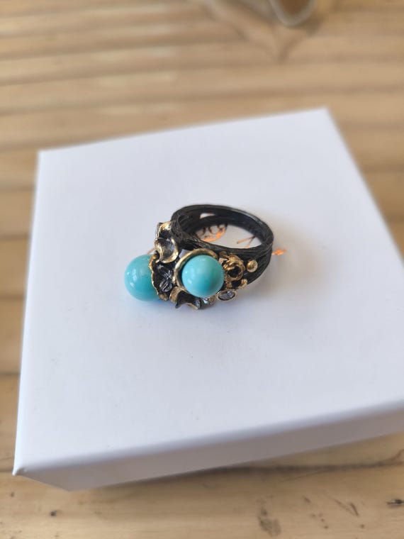 Silver ring with natural turquoises and white topazes