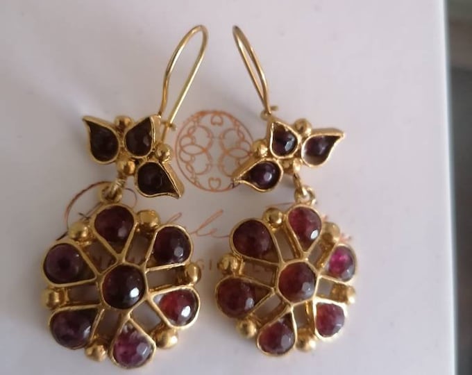 Gold earrings with natural garnets, ancient art