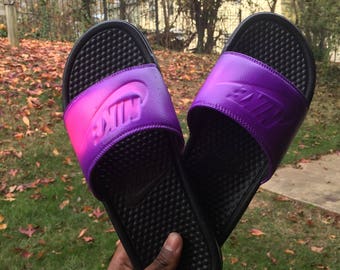 purple and gold nike slides