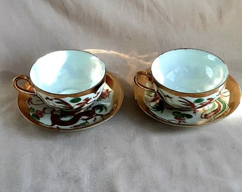 Two antique gilded porcelain  tea cups from China , rooster ,dragons.