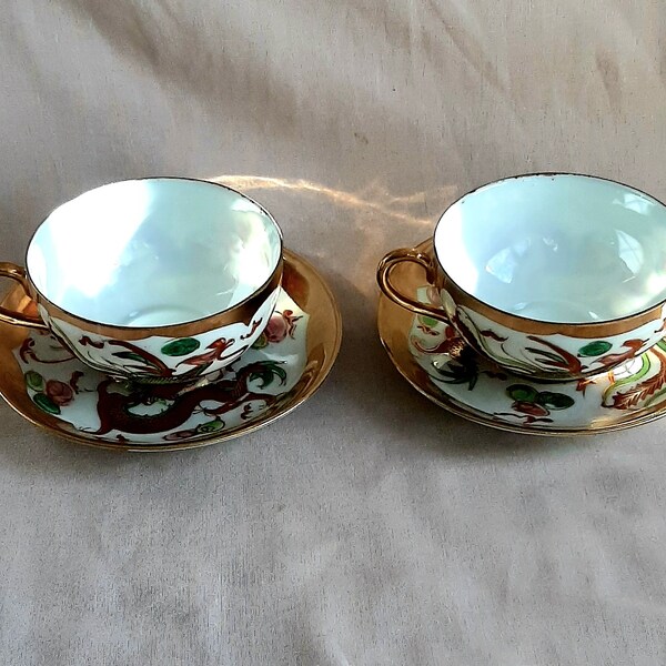 Two antique gilded porcelain  tea cups from China , rooster ,dragons.