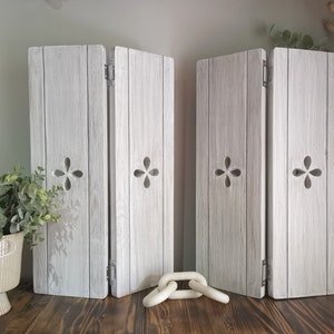 May include: A rustic wooden sign with the text "Welcome to our home" in a handwritten style. The sign has a distressed finish and a simple, inviting design, suitable for a front porch or entryway.