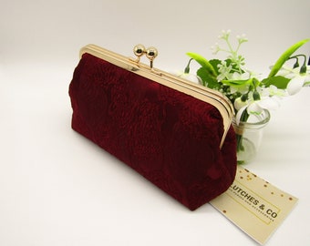 maroon clutch bag