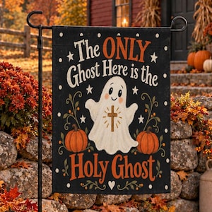 May include: A rectangular black garden flag featuring a white cartoon ghost illustration with a brown cross on its chest. The text reads The ONLY Ghost Here is the Holy Ghost. The design includes orange pumpkins, green vines, and white stars.