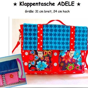 May include: A red and blue patchwork style bag with a flap closure. The bag has a blue star pattern, white polka dots, and floral fabric accents. The bag measures 31 cm wide and 24 cm high. The bag is labelled "Klappentasche ADELE".