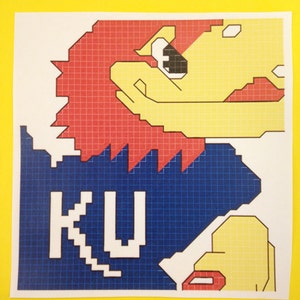 May include: A pixelated image of a red and yellow mascot with a blue background. The mascot is holding a sign that says "KU".