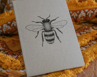 Abeille de cahier de papier d’herbe