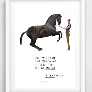 May include: A black and white illustration of a horse rearing up on its hind legs. A person in a brown vest and hat is holding a lead rope attached to the horse's bridle. The text reads: "Die Dressur ist f&uuml;r das Pferd da nicht das Pferd f&uuml;r die Dressur."  The artist's signature is "B. Brandebur."