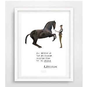 May include: A watercolor illustration of a black horse rearing up on its hind legs. A person in a hat and brown pants is holding a lead rope attached to the horse's bridle. The text below the image reads: "Die Dressur ist f&uuml;r das Pferd da nicht das Pferd f&uuml;r die Dressur."  The artist's signature, "B. BRANDErup", is below the text.