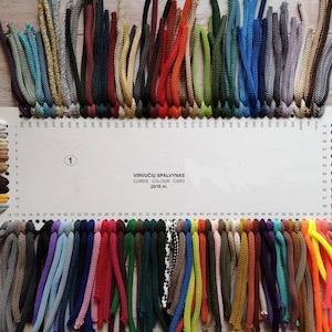 May include: A color card with a variety of cords in different colors. The card is labeled "Virvuciu Spalvynas" and "Cords, Color Card, 2016 m."