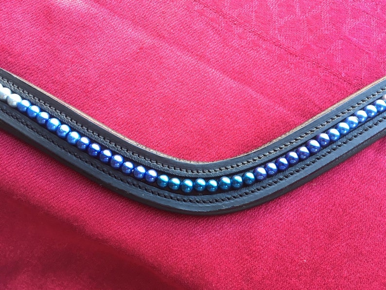 Horse Browband Blue Ombre Various shades of white to blue pearls in an ombre effect on softly padded black or brown leather