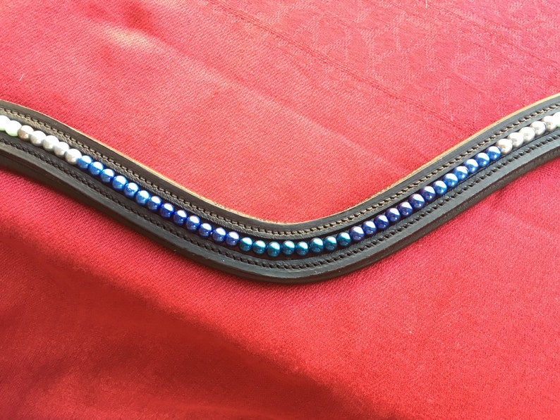 Horse Browband Blue Ombre Various shades of white to blue pearls in an ombre effect on softly padded black or brown leather