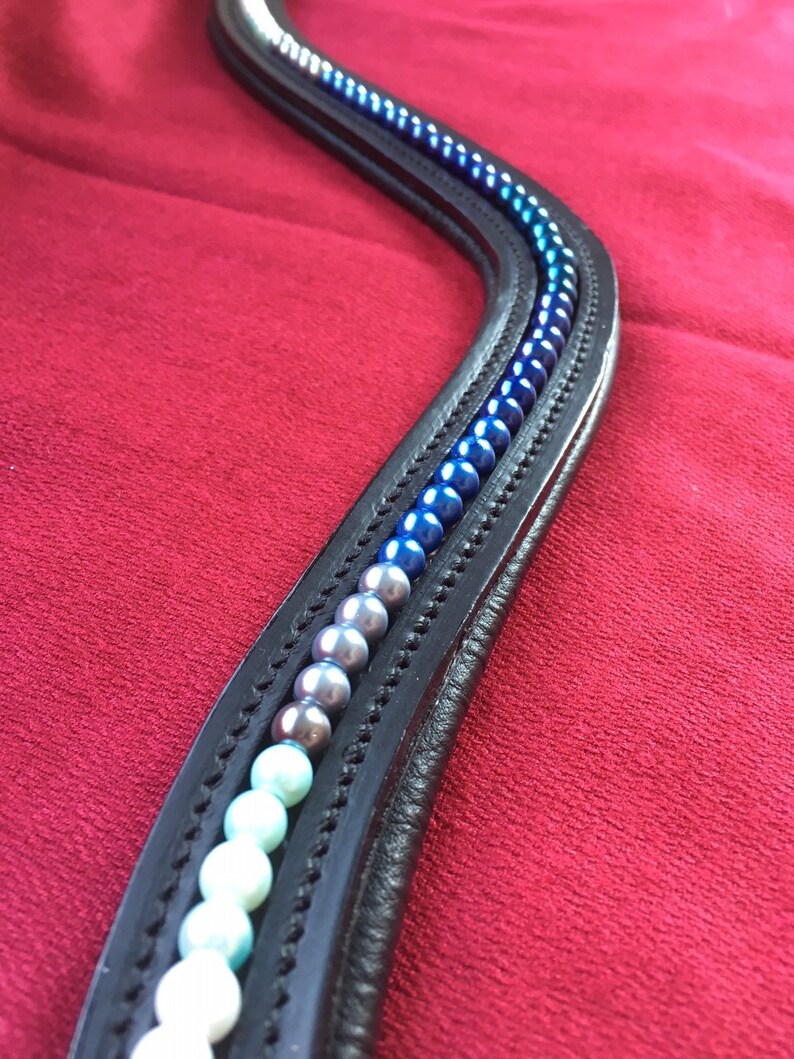 Horse Browband Blue Ombre Various shades of white to blue pearls in an ombre effect on softly padded black or brown leather