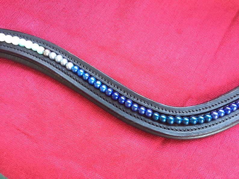 Horse Browband Blue Ombre Various shades of white to blue pearls in an ombre effect on softly padded black or brown leather