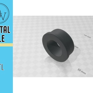 Puede incluir: Un anillo de plástico negro con un agujero en el centro. El anillo tiene un diámetro de aproximadamente 5 cm y un ancho de 2,5 cm.