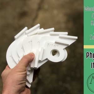 May include: Set of seven white plastic corner radius jigs for woodworking. The jigs are labeled with different radius sizes, including 1/16", 1/8", 1/4", 3/8", 1/2", 5/16", and 1".