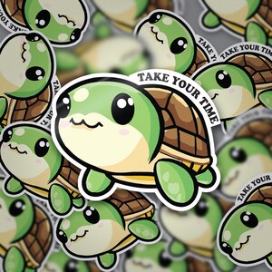 May include: A green cartoon turtle with a brown shell and the text "Take Your Time" on its shell. The turtle has big eyes and a cute expression. The background is a blurry image of other turtles with the same design.