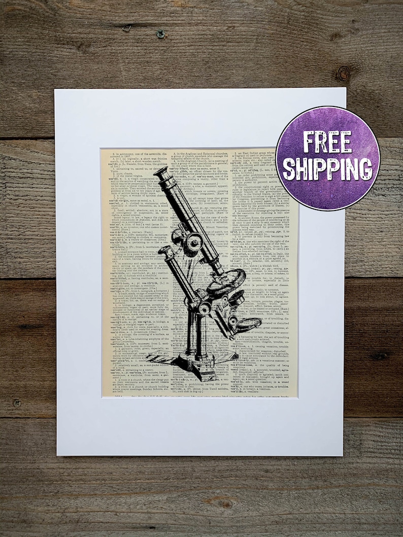 May include: A black and white illustration of a vintage microscope on a page from an old dictionary. The microscope is in focus and the dictionary text is blurred in the background.