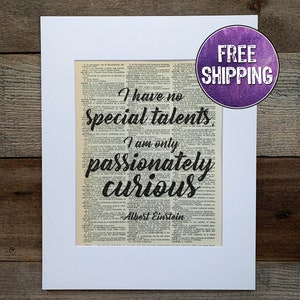 May include: A black and white printable art print with a vintage dictionary page background. The quote "I have no special talents. I am only passionately curious." is written in black script with the name "Albert Einstein" below. The print is framed with a white mat.