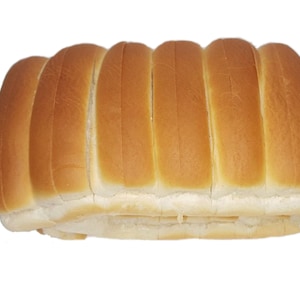 May include: A loaf of soft, white bread sliced into individual rolls. The rolls are arranged in a row, ready to be used for sandwiches or other recipes.