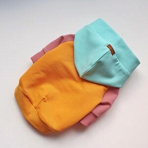 Color-block dog hoodie in mint, mustard yellow, and dusty pink. Handmade from soft cotton French Terry for teacup, small dogs, and puppies. Cozy, stylish, and lightweight pet sweater with custom fit. Perfect for chilly walks and everyday wear. Custom-made to fit different dog breeds like Yorkies, Chihuahuas, and Toy Poodles. High-quality craftsmanship with durable stitching.