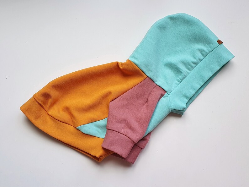 Color-block dog hoodie in mint, mustard yellow, and dusty pink. Handmade from soft cotton French Terry for teacup, small dogs, and puppies. Cozy, stylish, and lightweight pet sweater with custom fit. Perfect for chilly walks and everyday wear. Custom-made to fit different dog breeds like Yorkies, Chihuahuas, and Toy Poodles. High-quality craftsmanship with durable stitching.