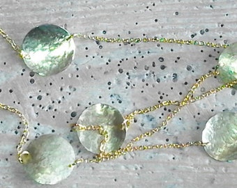Long necklace with inserts in brass or hammered copper