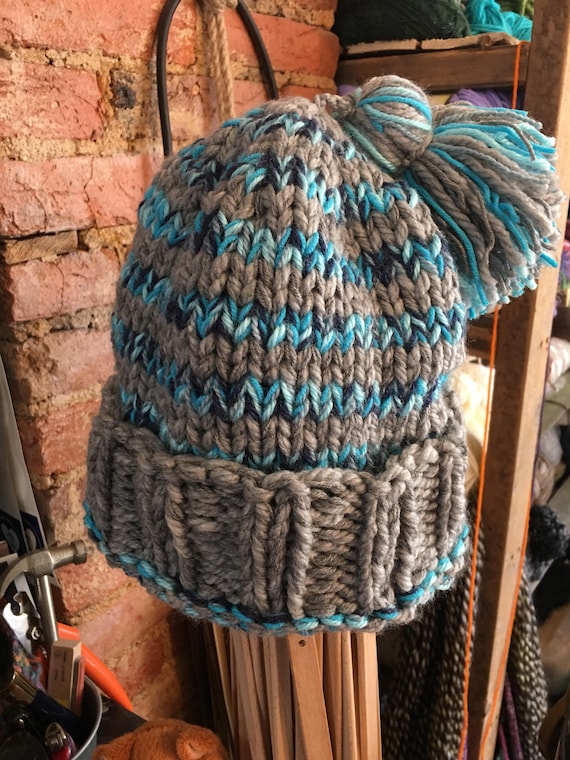 Hand knitted striped winter hat in stripes of your color choice. Tassel detail. Adult