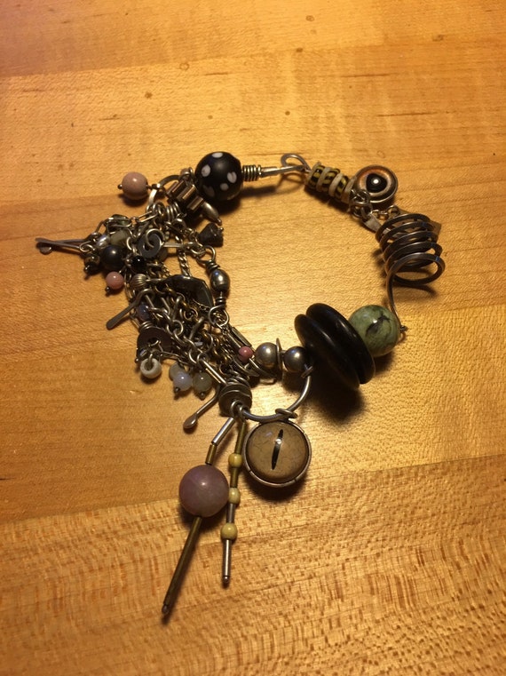 Beautiful handmade bracelet from the Philadelphia Museum of Art . Sterling silver, semi-precious beads and glass eyes!