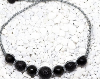 Grey macrame bracelet with black lava and golden sheen obsidian beads