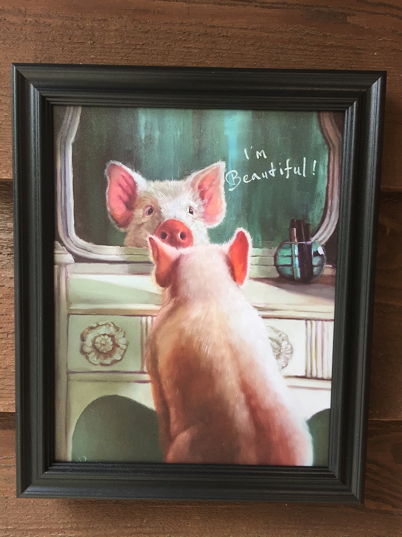 May include: A framed painting of a pig looking at its reflection in a mirror. The pig is pink and white and has a pink nose. The mirror is on a vanity with a bottle of perfume. The text "I'm Beautiful!" is written on the mirror.