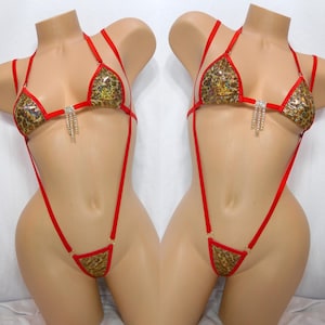 May include: A white ceramic mug with a black handle and the text "But first, coffee" in a black, handwritten-style font. The mug is on a white surface.