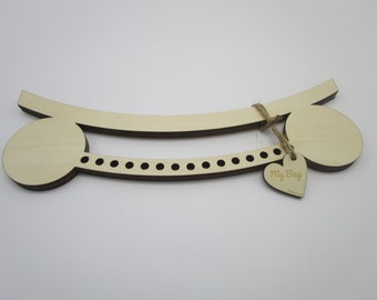May include: Wooden craft kit for making a bag, with a curved base and a heart-shaped tag that says "My Bag".