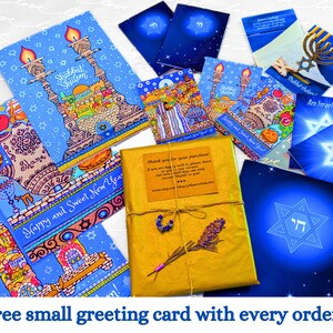 May include: A collection of greeting cards with Jewish themes. The cards feature illustrations of a menorah, a Star of David, and a Shabbat Shalom greeting. The cards are blue, gold, and white. The text on the cards reads "Shabbat Shalom", "Am Israel Chai!" and "Happy and Sweet New Year".