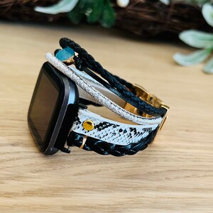 5 straps layered bracelet. braided strap, snake skin strap, leather strap decorated with stone imitation.