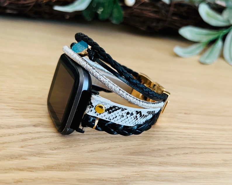5 straps layered bracelet. braided strap, snake skin strap, leather strap decorated with stone imitation.